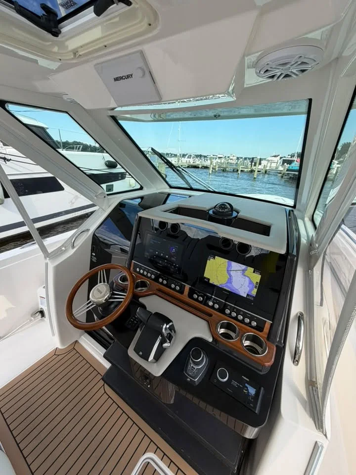 Helm with teak sole and wood wheel, wiped clean