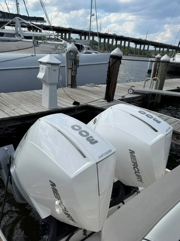 Twin Mercury outboards after a wash